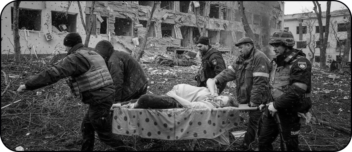 Rescuers carry a woman injured during Mariupol maternity hospital bombing